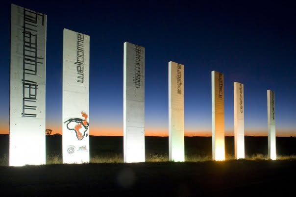 Maropeng — welcome monoliths glowing at dusk