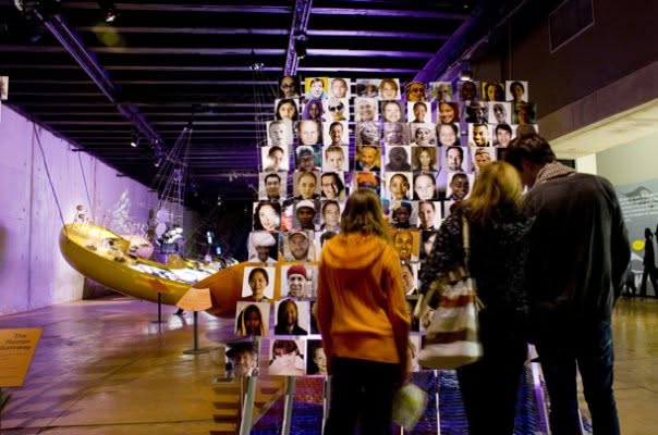 Maropeng — visitors at the faces of humanity portrait wall
