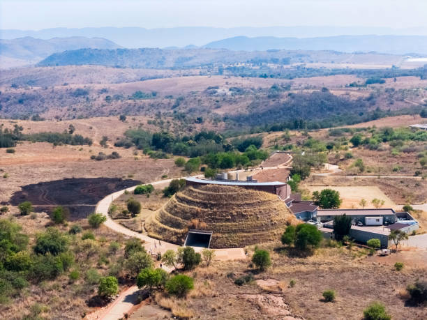 Maropeng — Tumulus mound with Magaliesberg hills beyond